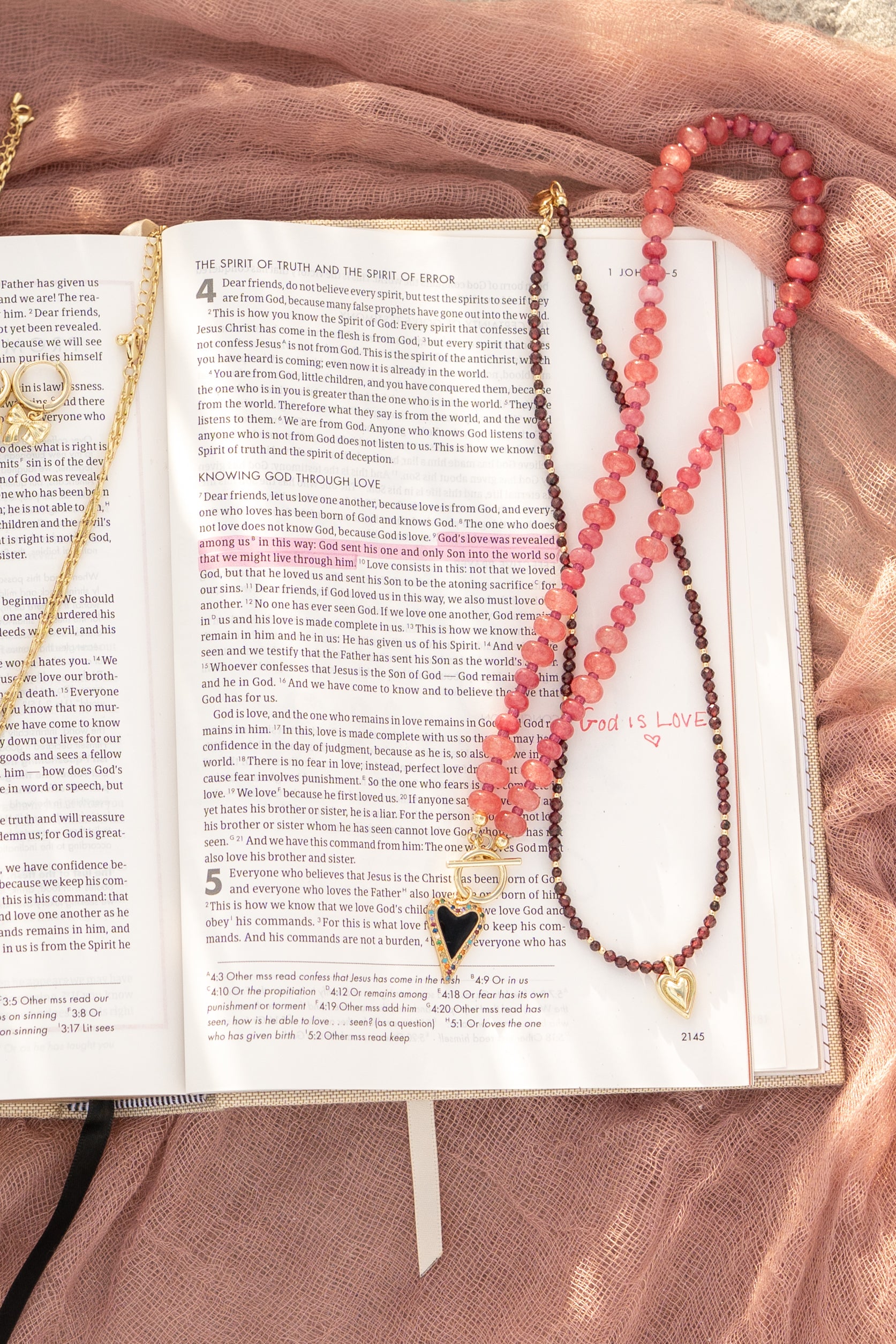 2 beaded necklaces on an open bible